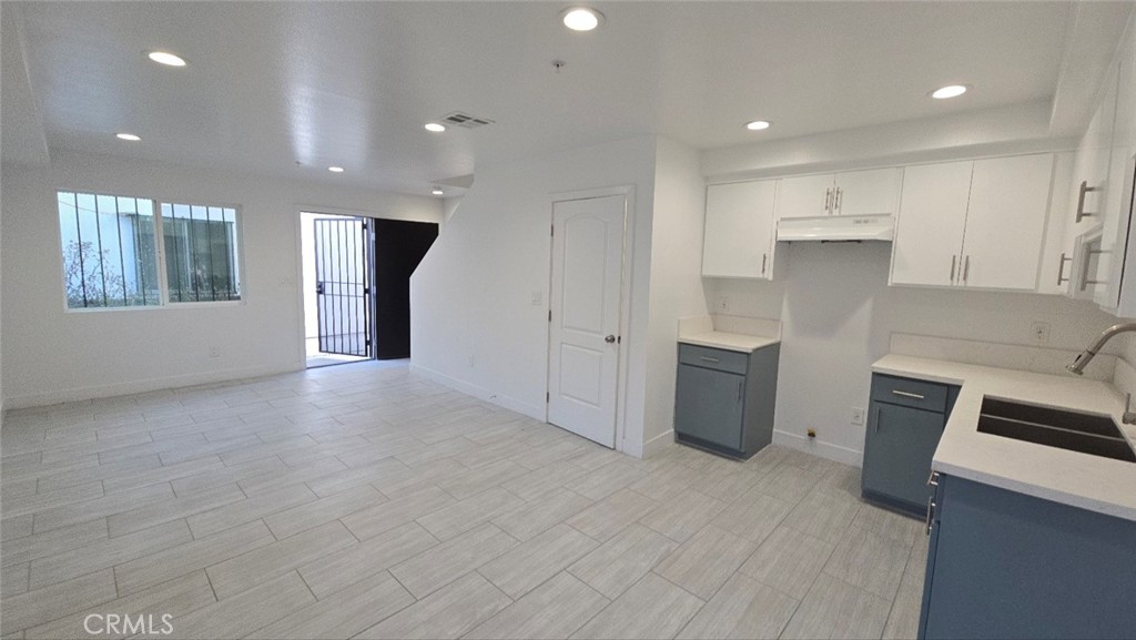 10415 1/2 Avalon Boulevard Los Angeles, CA 90003 - Photo 15 of 24 a view of a kitchen with a sink cabinets and a window