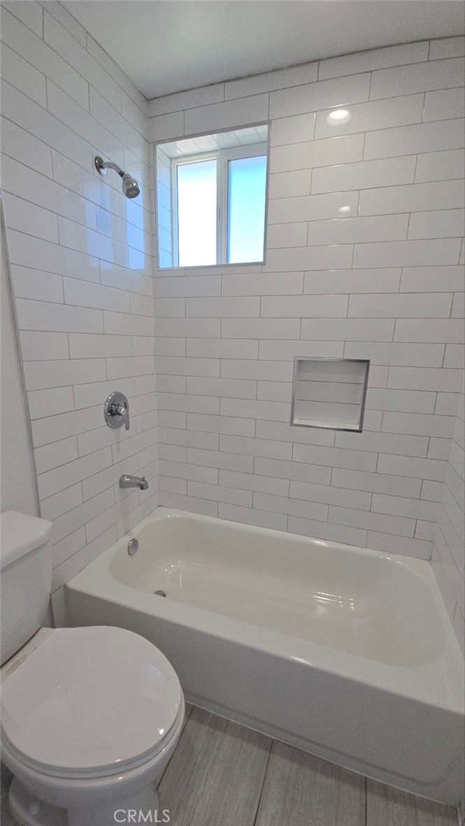 10415 1/2 Avalon Boulevard Los Angeles, CA 90003 - Photo 24 of 24 a bathroom with a toilet and a bathtub