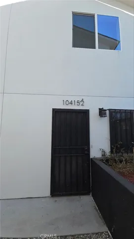 a kitchen with a refrigerator and a sink
