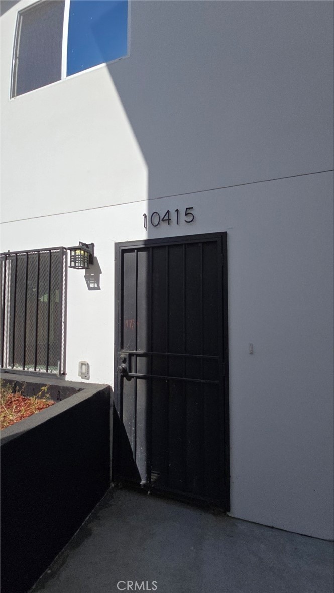 10415 1/2 Avalon Boulevard Los Angeles, CA 90003 - Photo 6 of 24 a kitchen with a refrigerator and a sink