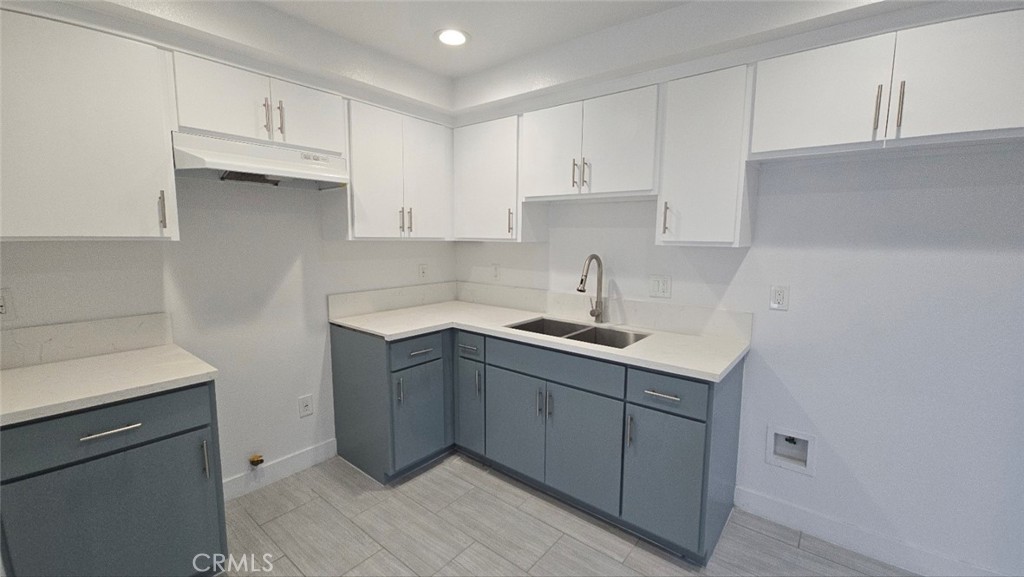 10415 1/2 Avalon Boulevard Los Angeles, CA 90003 - Photo 9 of 24 a kitchen with cabinets appliances a sink and a counter top space
