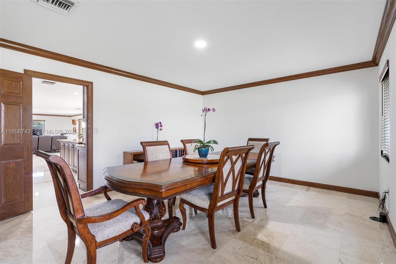 20520 Southwest 190th Street Miami, FL 33187 - Photo 12 of 39 a view of a dining room with furniture and window