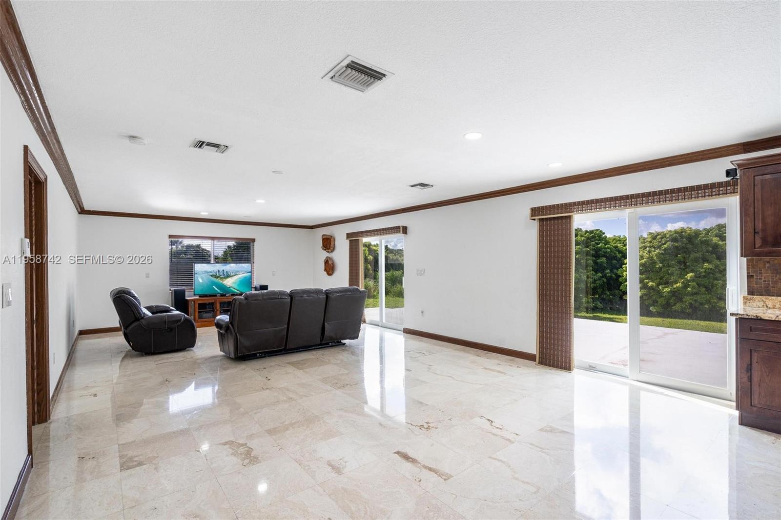 20520 Southwest 190th Street Miami, FL 33187 - Photo 15 of 39 a living room with furniture and windows