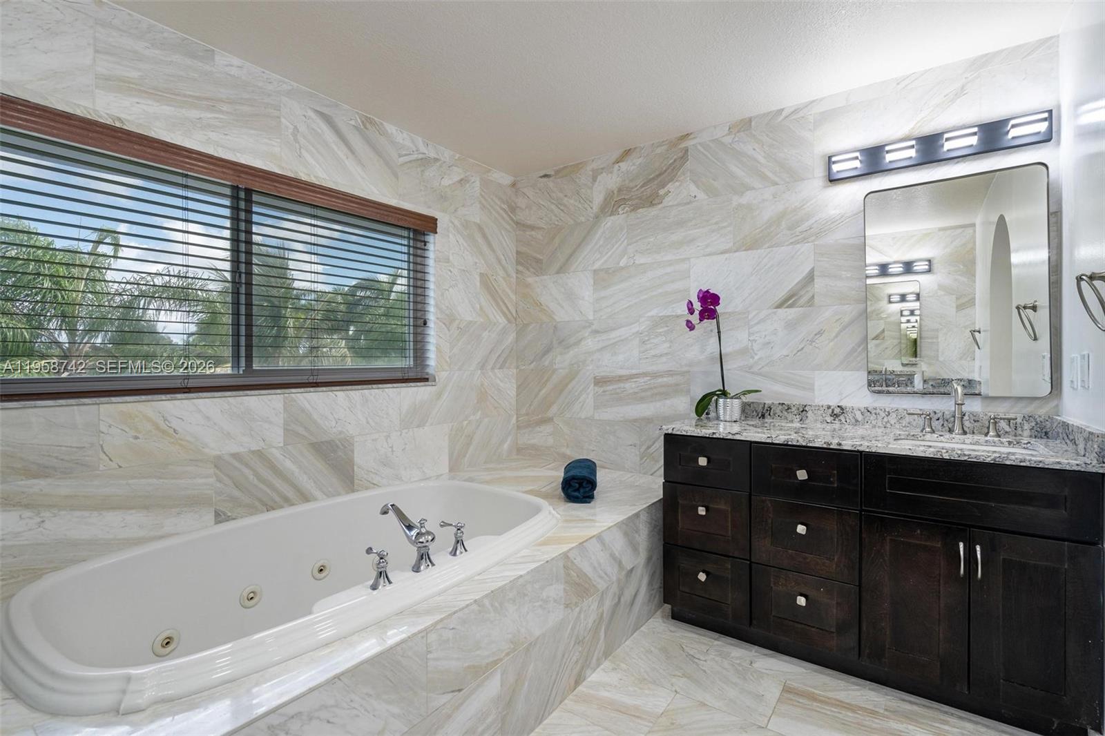20520 Southwest 190th Street Miami, FL 33187 - Photo 21 of 39 a bathroom with a tub a sink and a window