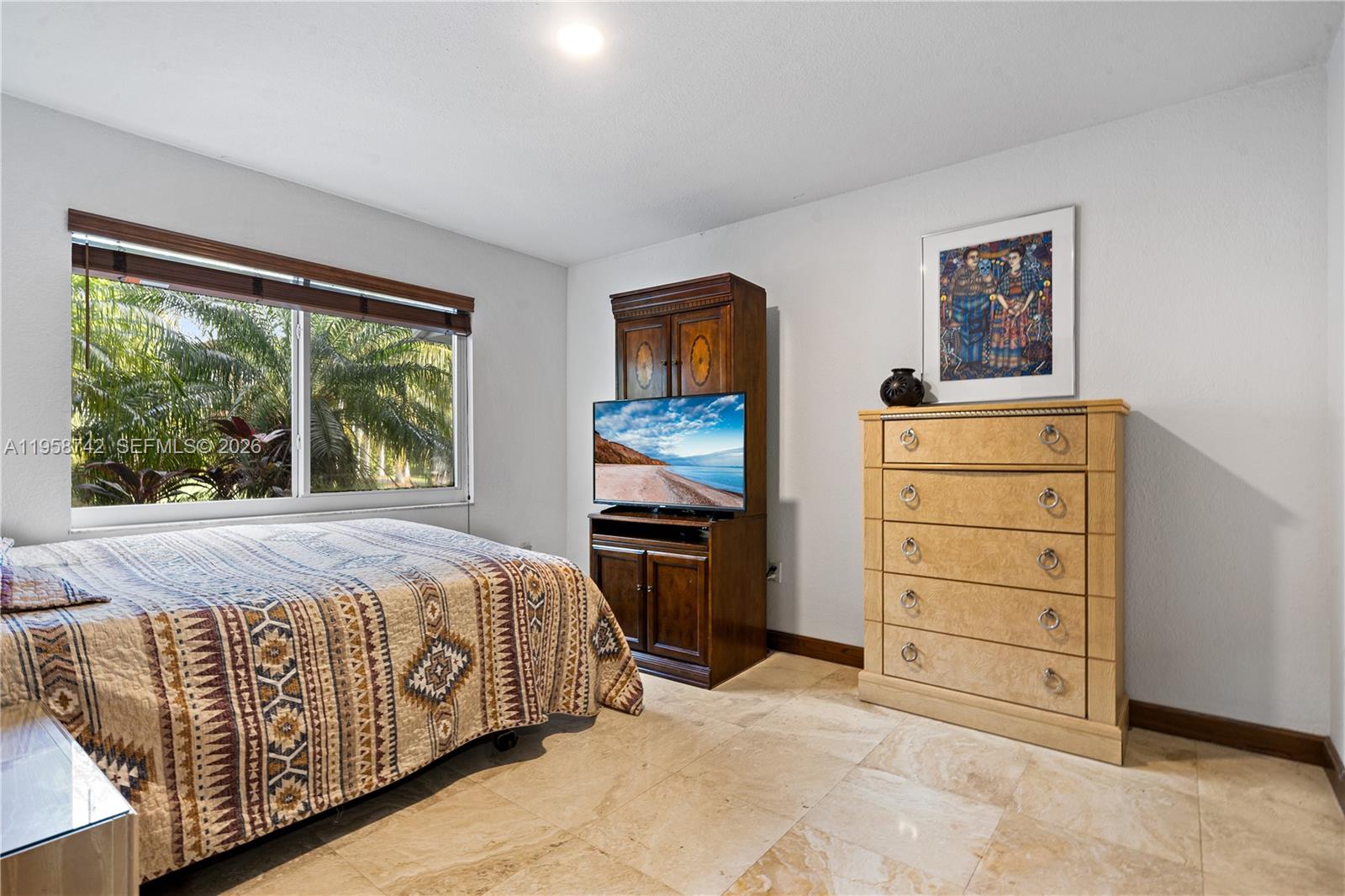 20520 Southwest 190th Street Miami, FL 33187 - Photo 23 of 39 a bedroom with a bed and a dresser