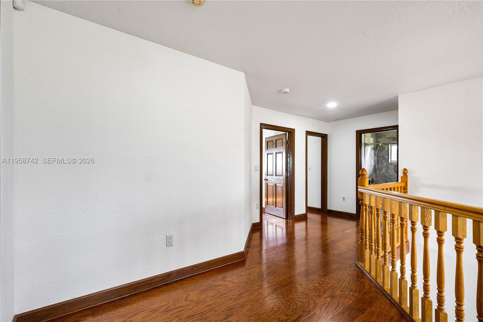 20520 Southwest 190th Street Miami, FL 33187 - Photo 24 of 39 a view of a hallway with wooden floor