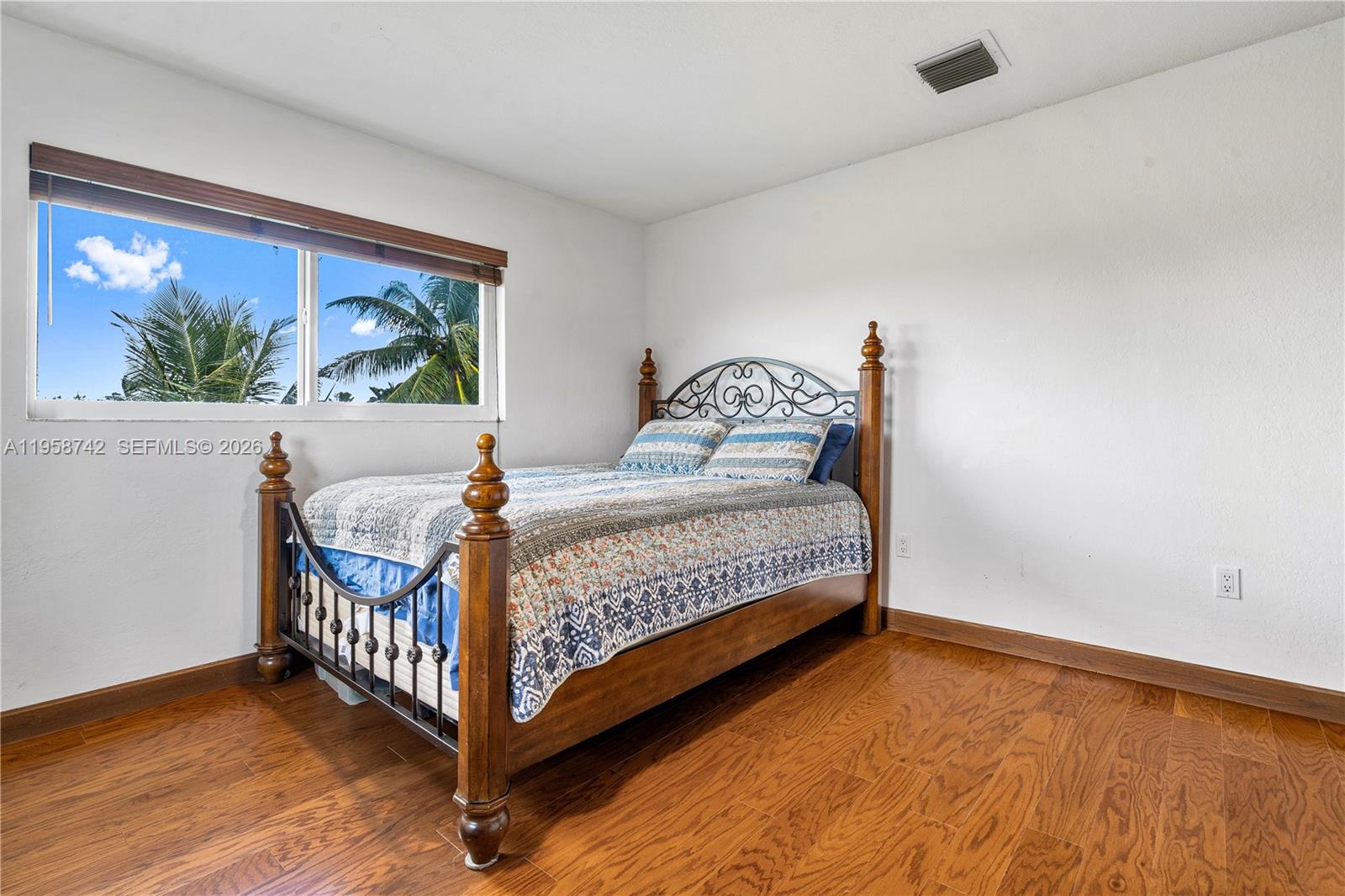 20520 Southwest 190th Street Miami, FL 33187 - Photo 31 of 39 a bedroom with a bed and a window