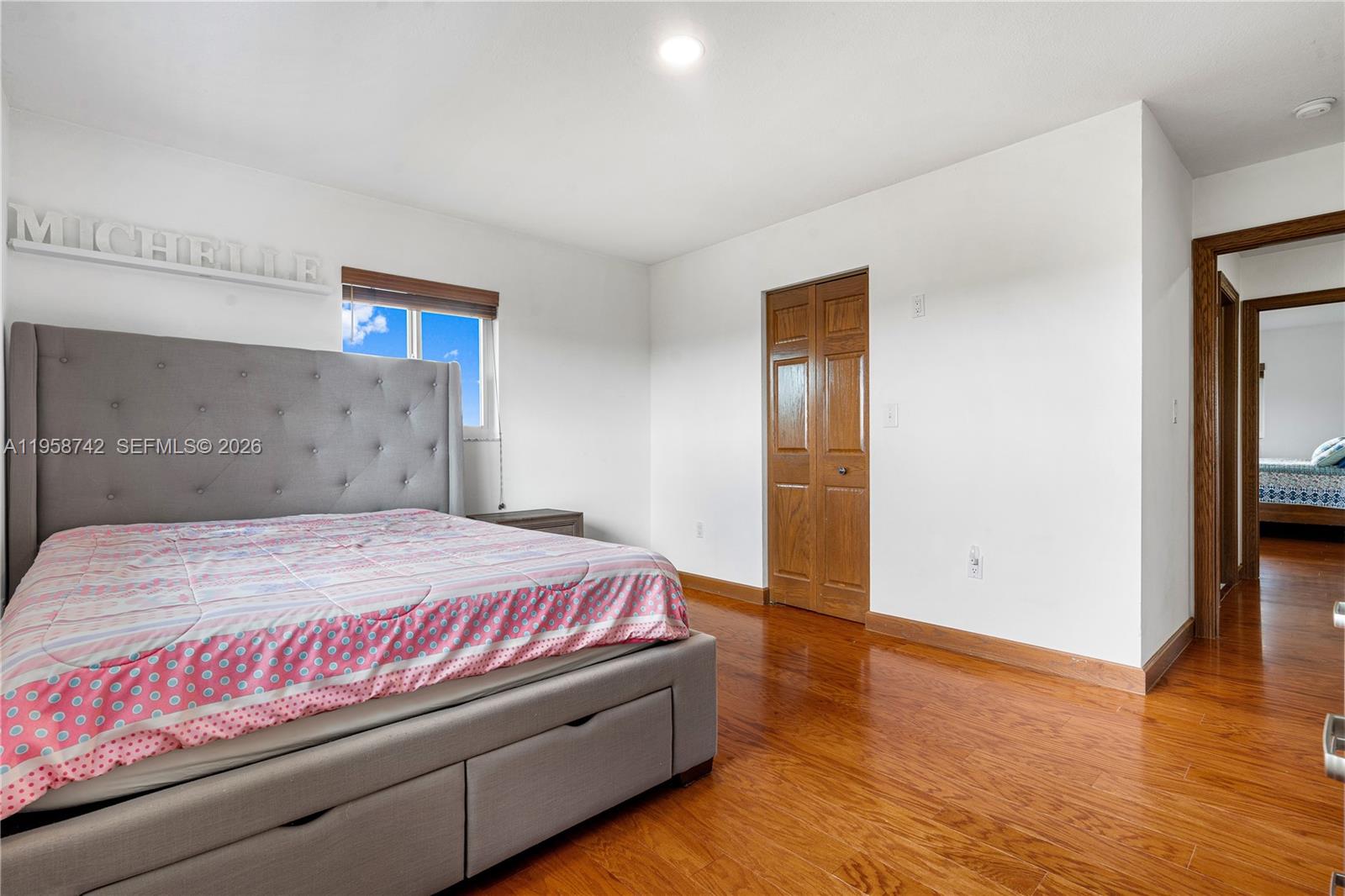 20520 Southwest 190th Street Miami, FL 33187 - Photo 32 of 39 a bedroom with a bed and wooden floor