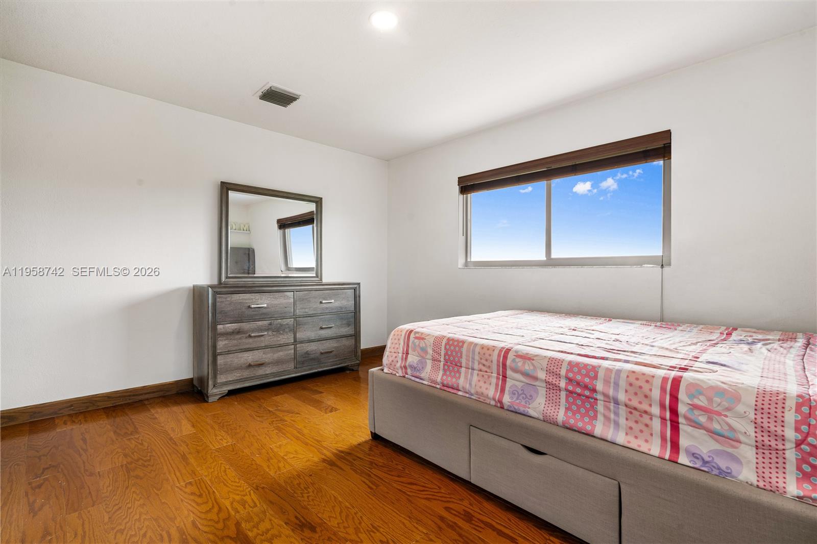 20520 Southwest 190th Street Miami, FL 33187 - Photo 33 of 39 a bedroom with a bed and a dresser