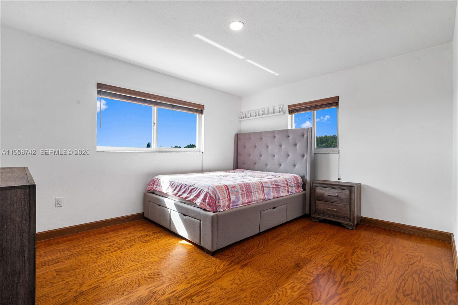 20520 Southwest 190th Street Miami, FL 33187 - Photo 34 of 39 a spacious bedroom with a bed and a dresser