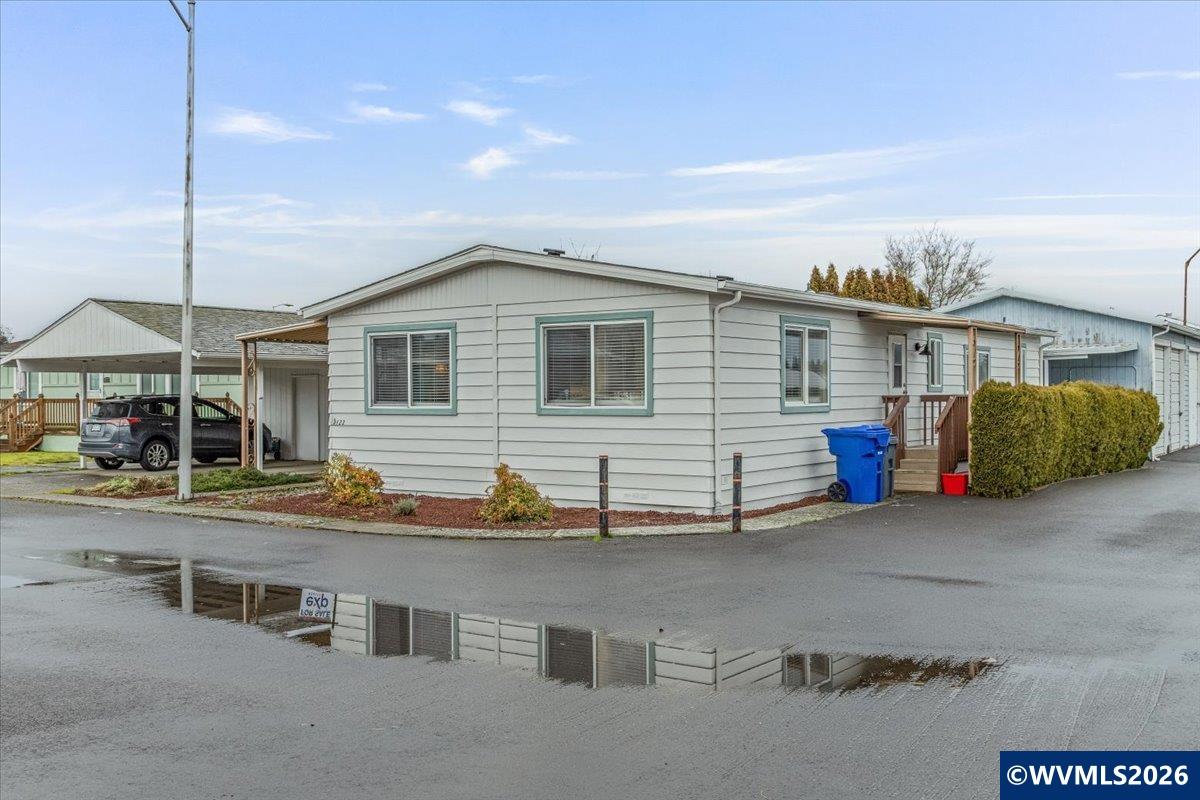 5422 Portland Road Northeast, Unit 123 Salem, OR 97305 - Photo 3 of 23 a view of a house with patio