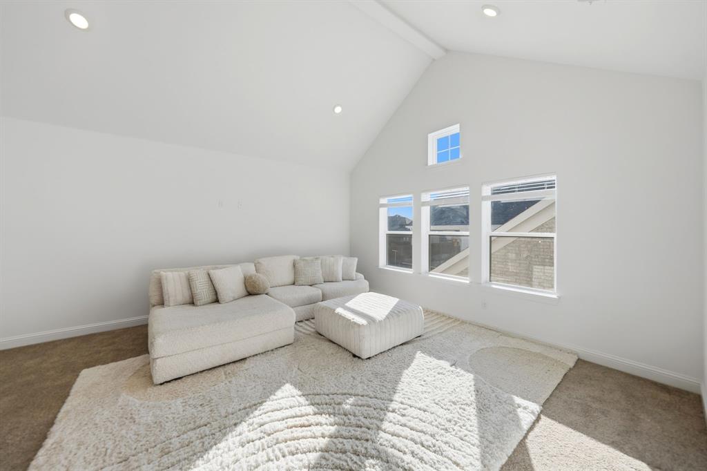 1227 Calebria Way Fate, TX 75087 - Photo 12 of 34 a living room with furniture and a window