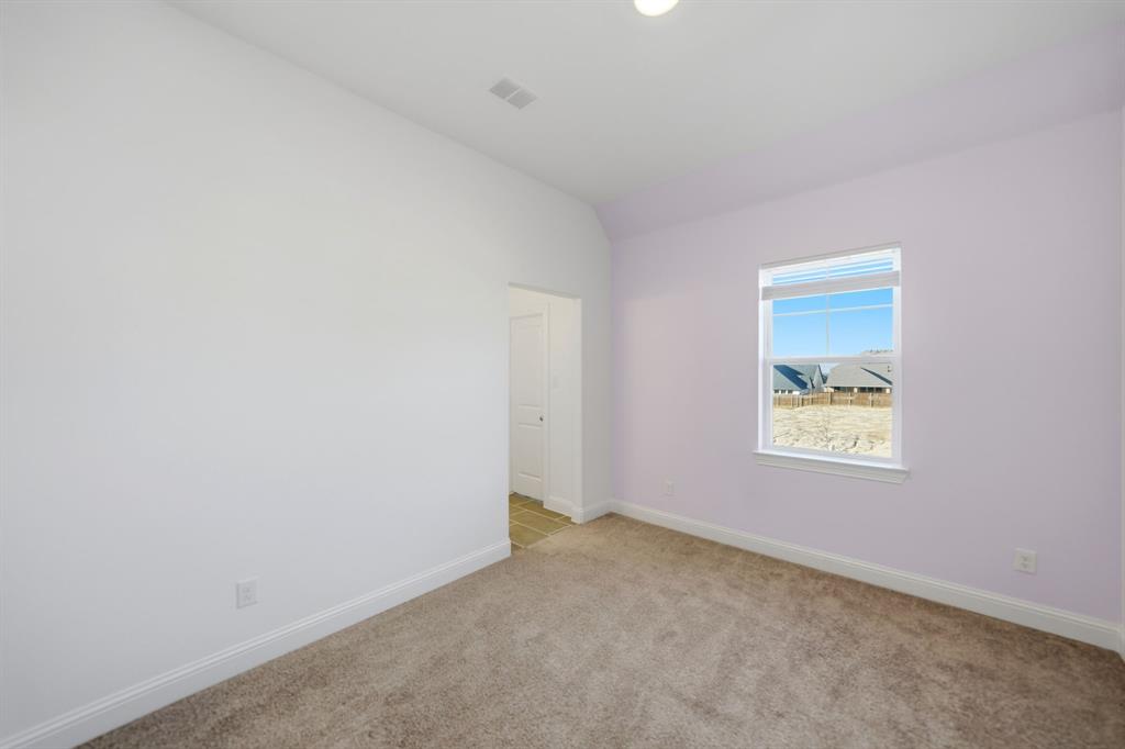 1227 Calebria Way Fate, TX 75087 - Photo 15 of 34 an empty room with a window