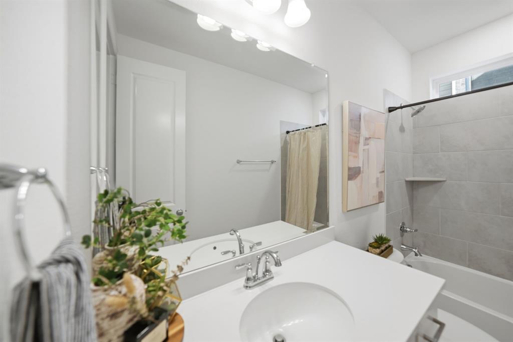 1227 Calebria Way Fate, TX 75087 - Photo 16 of 34 a bathroom with a sink toilet and shower