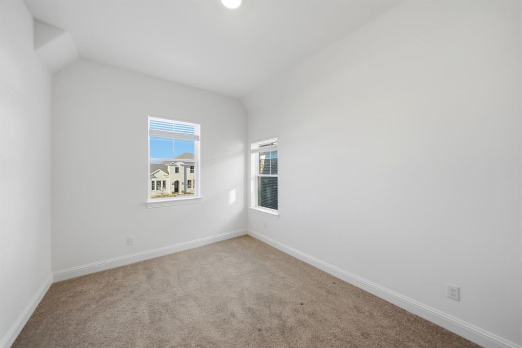 1227 Calebria Way Fate, TX 75087 - Photo 17 of 34 a view of an empty room with a window