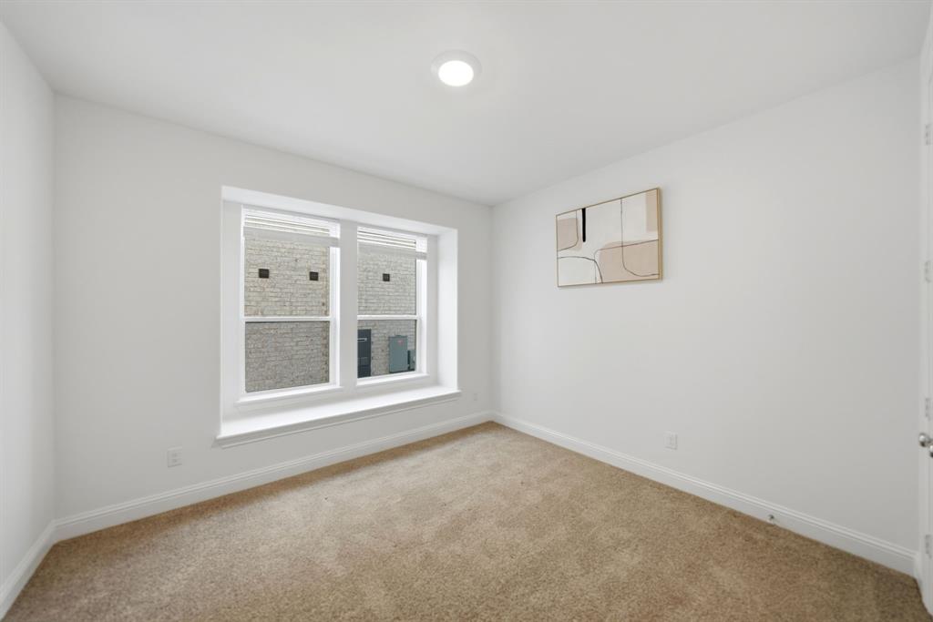 1227 Calebria Way Fate, TX 75087 - Photo 18 of 34 an empty room with a window