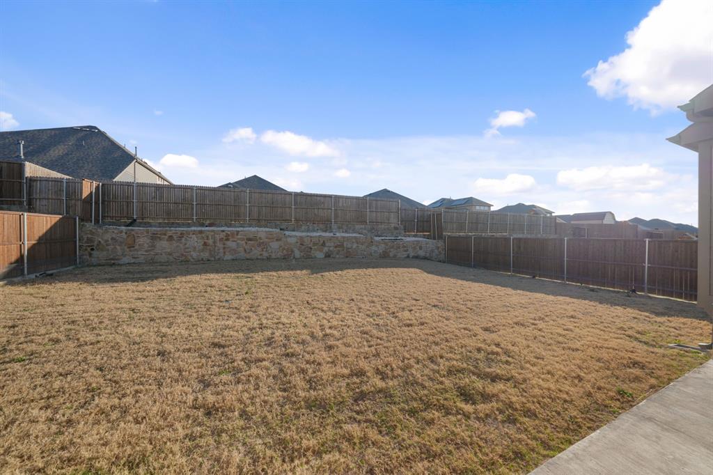 1227 Calebria Way Fate, TX 75087 - Photo 23 of 34 a view of a backyard