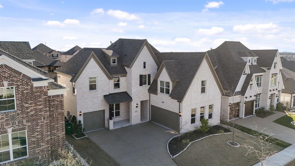 1227 Calebria Way Fate, TX 75087 - Photo 31 of 34 a view of a white house next to a yard