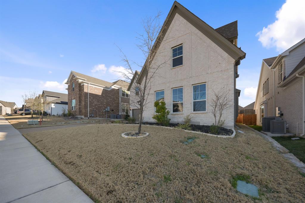 1227 Calebria Way Fate, TX 75087 - Photo 33 of 34 a view of a house with a backyard