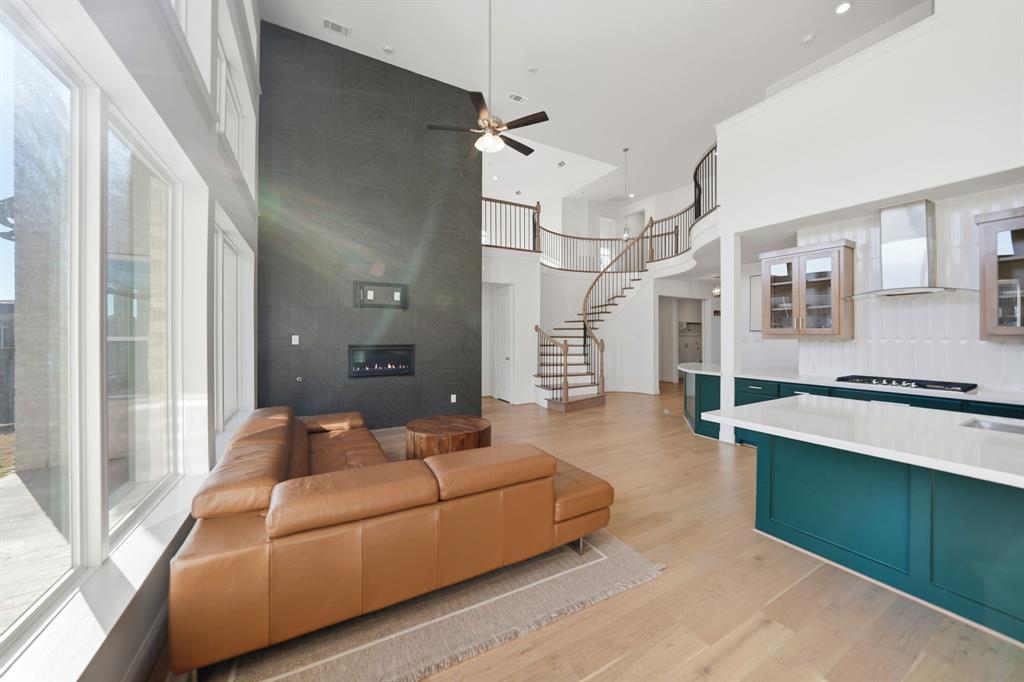 1227 Calebria Way Fate, TX 75087 - Photo 4 of 34 a living room with furniture and a large window