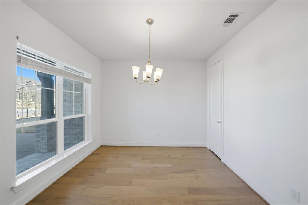 1227 Calebria Way Fate, TX 75087 - Photo 8 of 34 a view of an empty room with a window