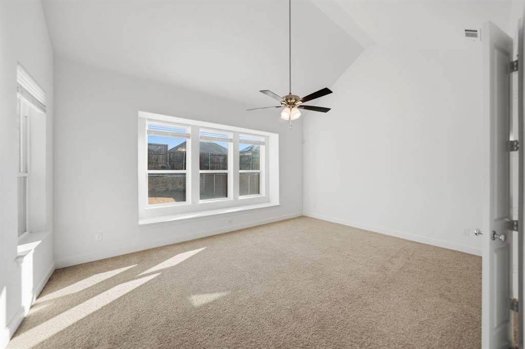 1227 Calebria Way Fate, TX 75087 - Photo 9 of 34 a view of an empty room with a window
