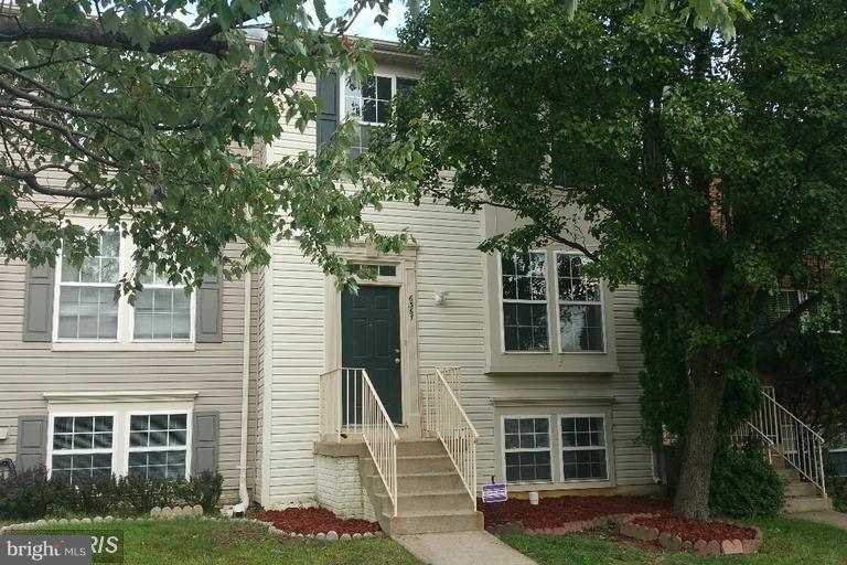 6367 Racetec Place Springfield, VA 22150 - Photo 1 of 25 a front view of a house with a yard