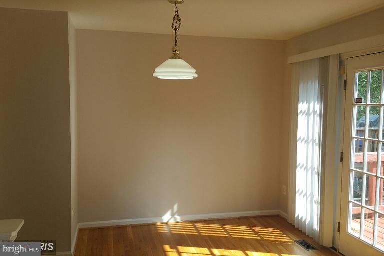 6367 Racetec Place Springfield, VA 22150 - Photo 13 of 25 a view of an empty room with a window