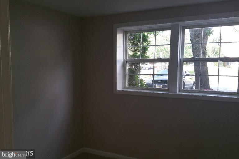 6367 Racetec Place Springfield, VA 22150 - Photo 18 of 25 a view of an empty room with a window