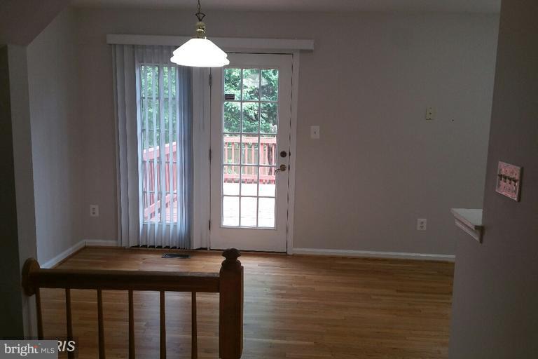 6367 Racetec Place Springfield, VA 22150 - Photo 23 of 25 a view of a room with wooden floor and a window