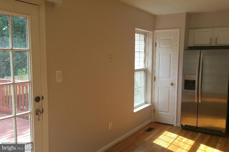 6367 Racetec Place Springfield, VA 22150 - Photo 8 of 25 a view of empty room with windows and wardrobe