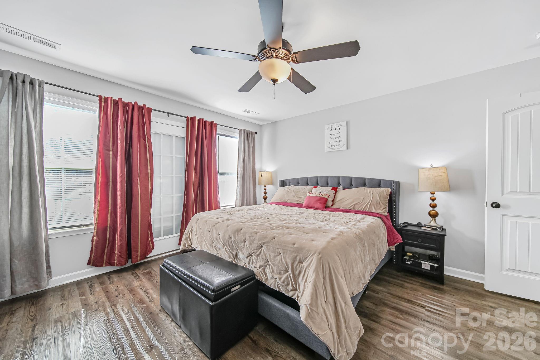 1189 West Elizabeth Street Pageland, SC 29728 - Photo 14 of 37 a bedroom with a bed and a chandelier