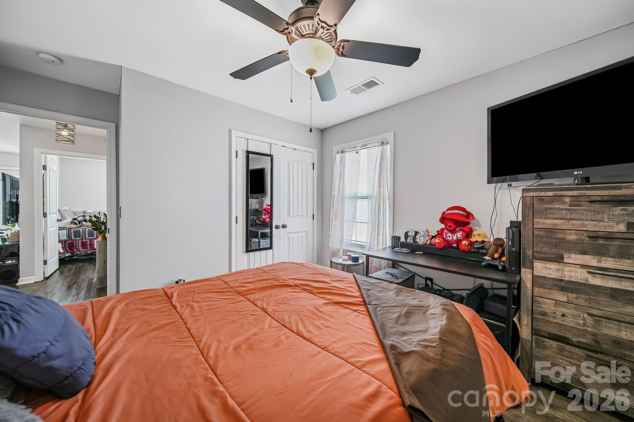 1189 West Elizabeth Street Pageland, SC 29728 - Photo 20 of 37 a bed room with a bed and a flat screen tv