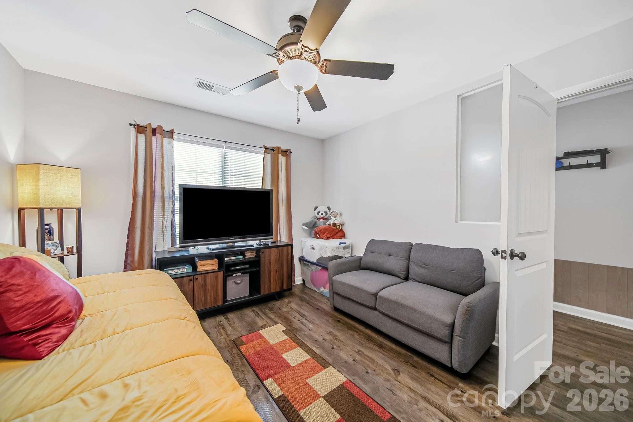 1189 West Elizabeth Street Pageland, SC 29728 - Photo 22 of 37 a living room with furniture and a flat screen tv