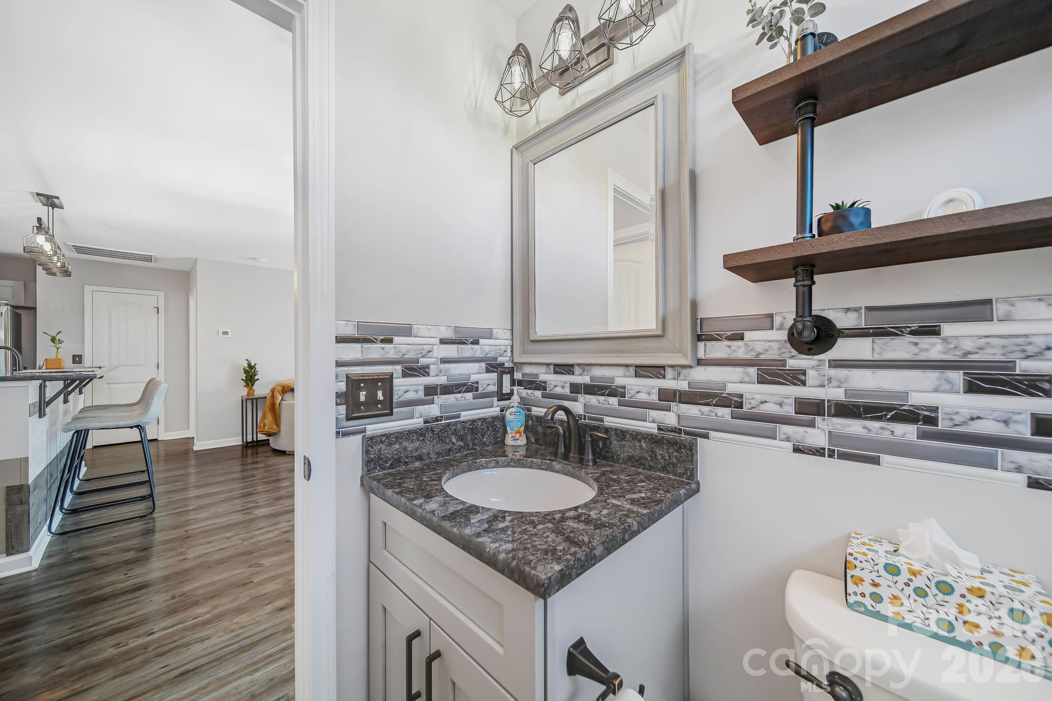 1189 West Elizabeth Street Pageland, SC 29728 - Photo 23 of 37 a bathroom with a sink and a mirror