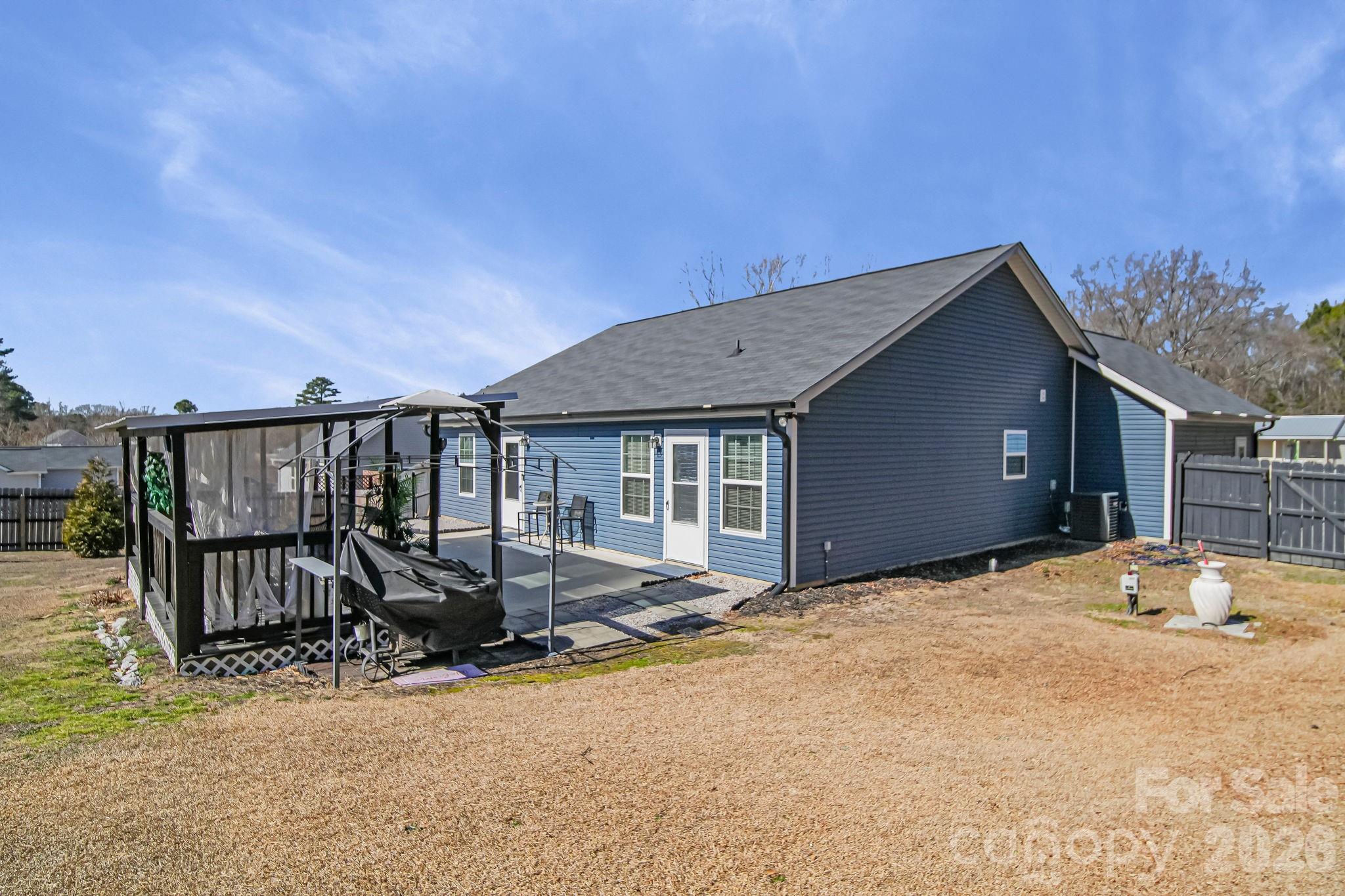 1189 West Elizabeth Street Pageland, SC 29728 - Photo 28 of 37 a view of a house with pool and furniture