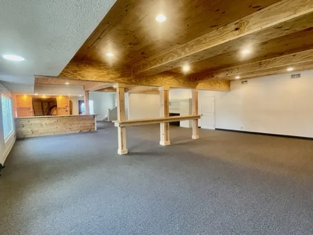 a view of empty room with a fireplace