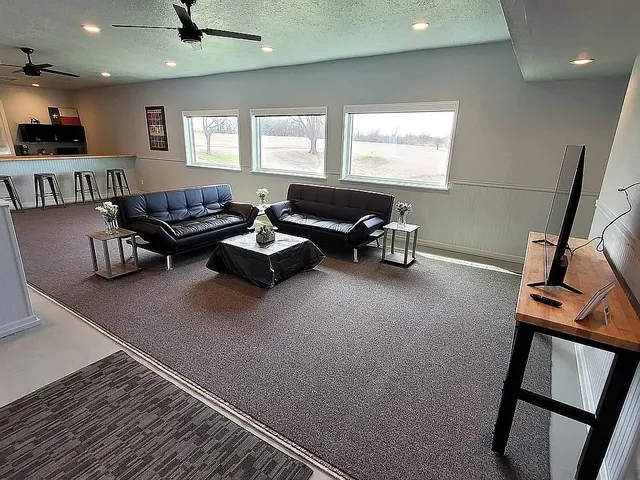 an empty room with a empty space and windows