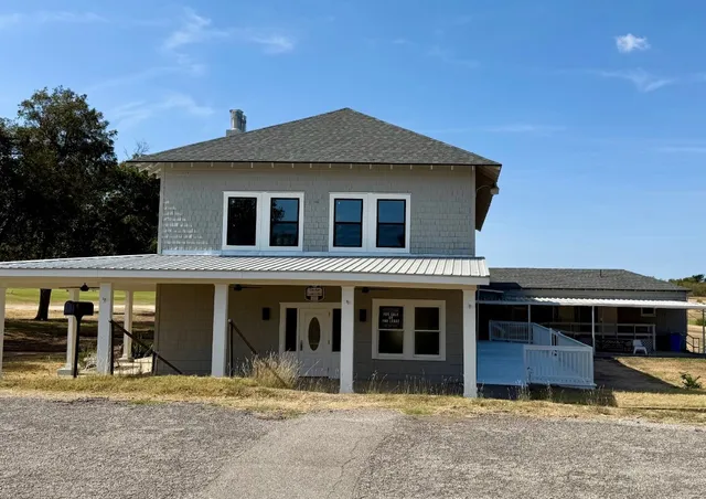 a front view of a house with glass windows
