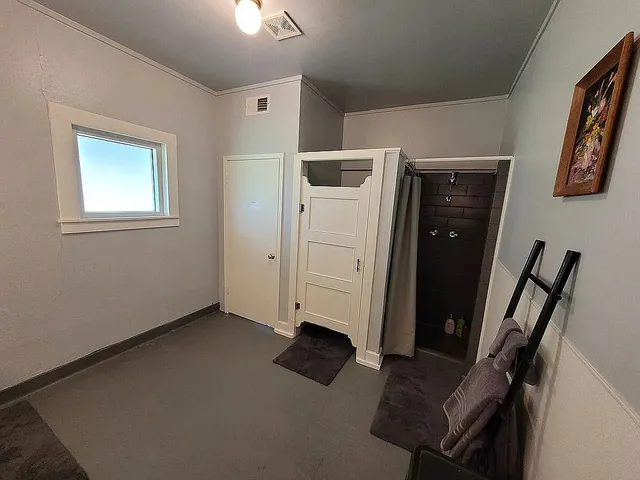 a bathroom with a double vanity sink a toilet and a tub