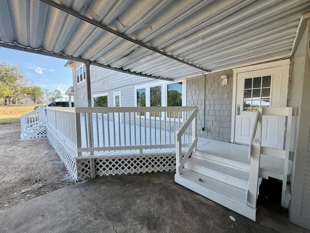 a view of porch with furniture