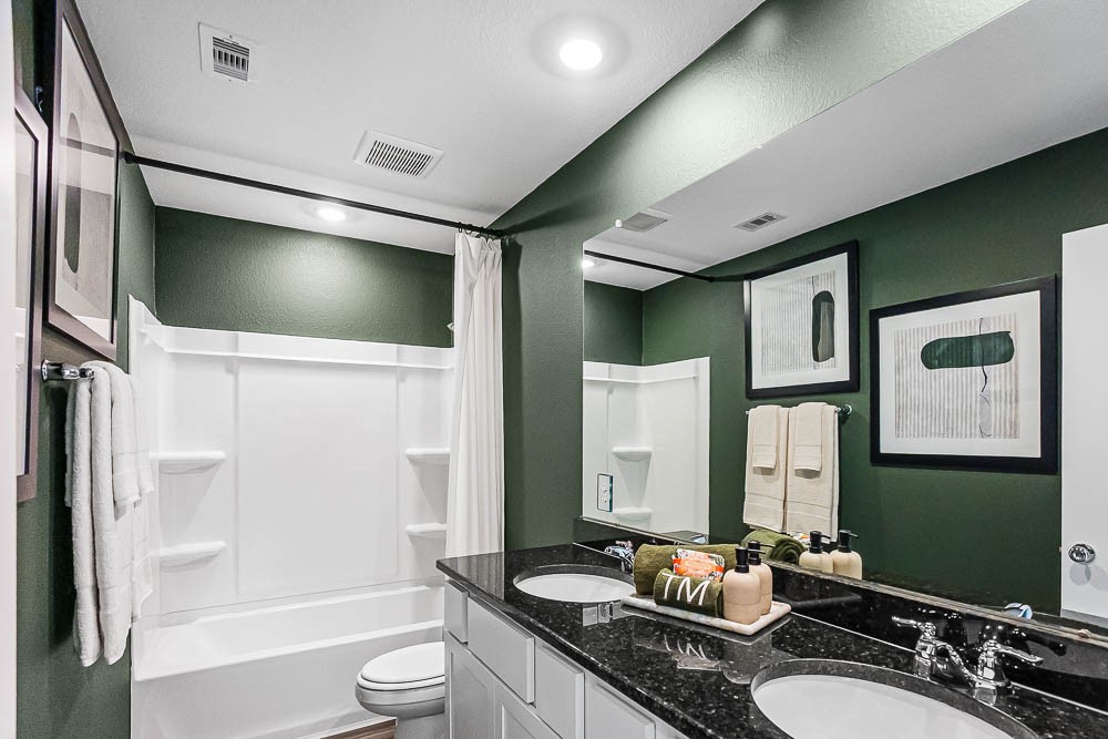 21930 Longhorn Rdg Drive Hockley, TX 77447 - Photo 24 of 39 a bathroom with a granite countertop sink toilet and shower