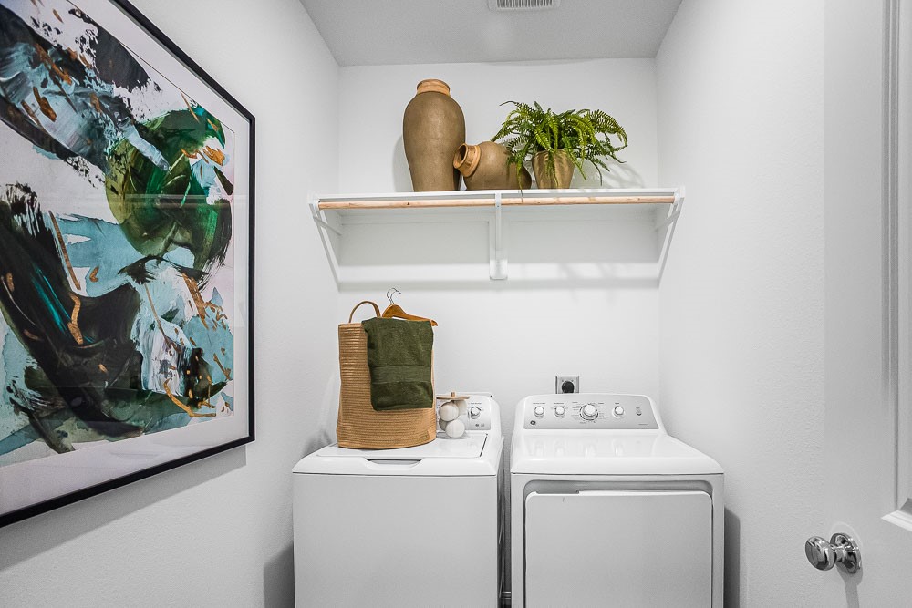 21930 Longhorn Rdg Drive Hockley, TX 77447 - Photo 25 of 39 a view of storage and utility room with washer and dryer