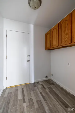 a view of a storage & utility room with wooden floor