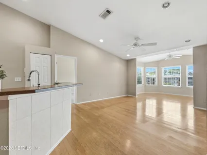 a view of kitchen with wooden floor