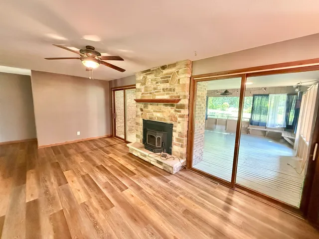 a view of an empty room with glass door