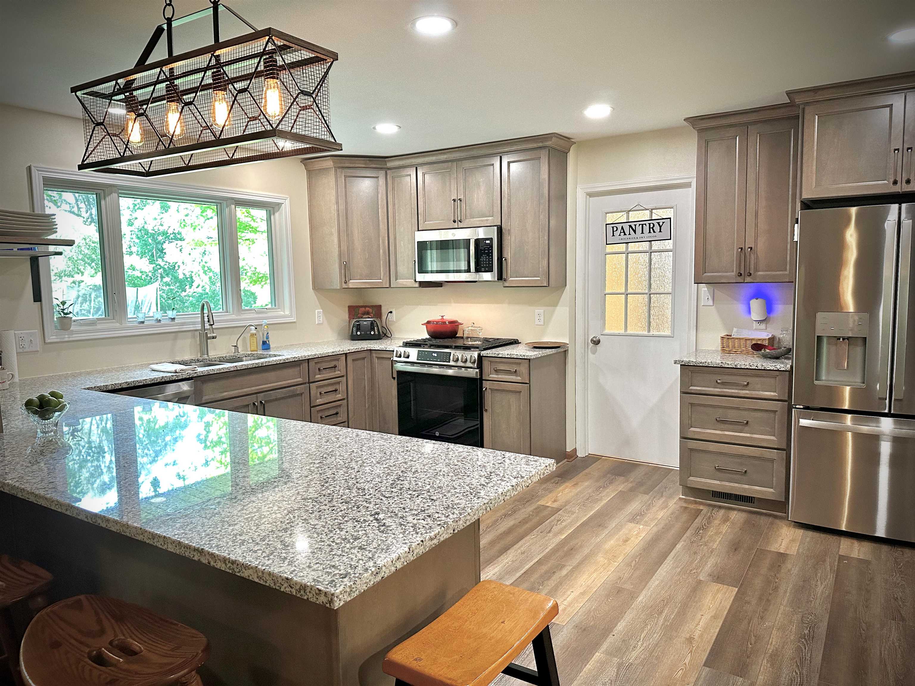7356 Kishwaukee Road Rockford, IL 61109 - Photo 23 of 71 a kitchen with stainless steel appliances granite countertop a sink stove and refrigerator