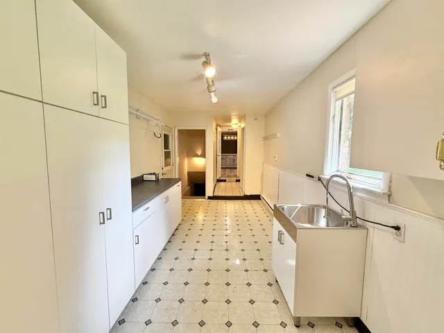a bathroom with a sink a mirror and a shower
