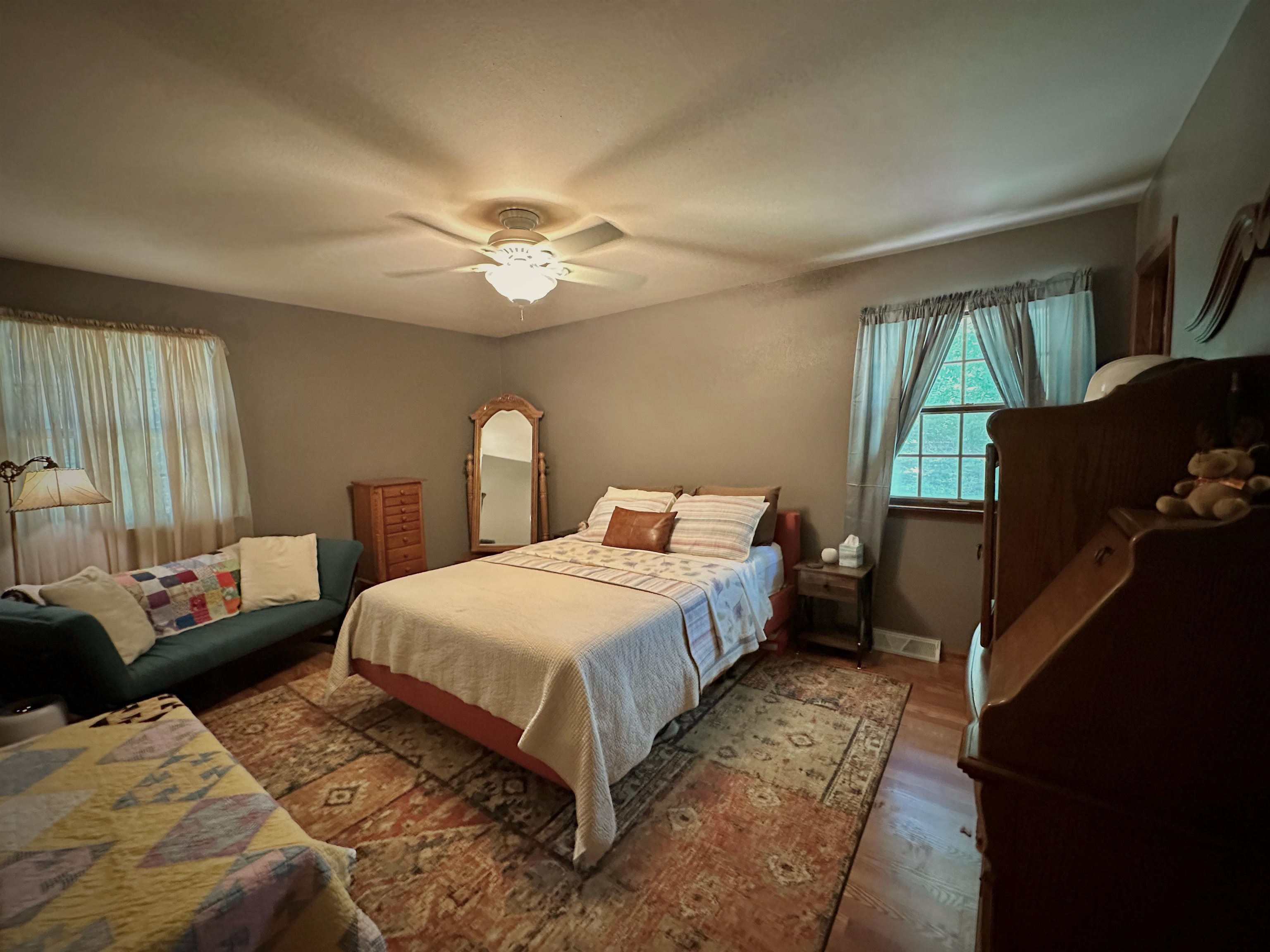 7356 Kishwaukee Road Rockford, IL 61109 - Photo 29 of 71 a bedroom with a bed and a chandelier