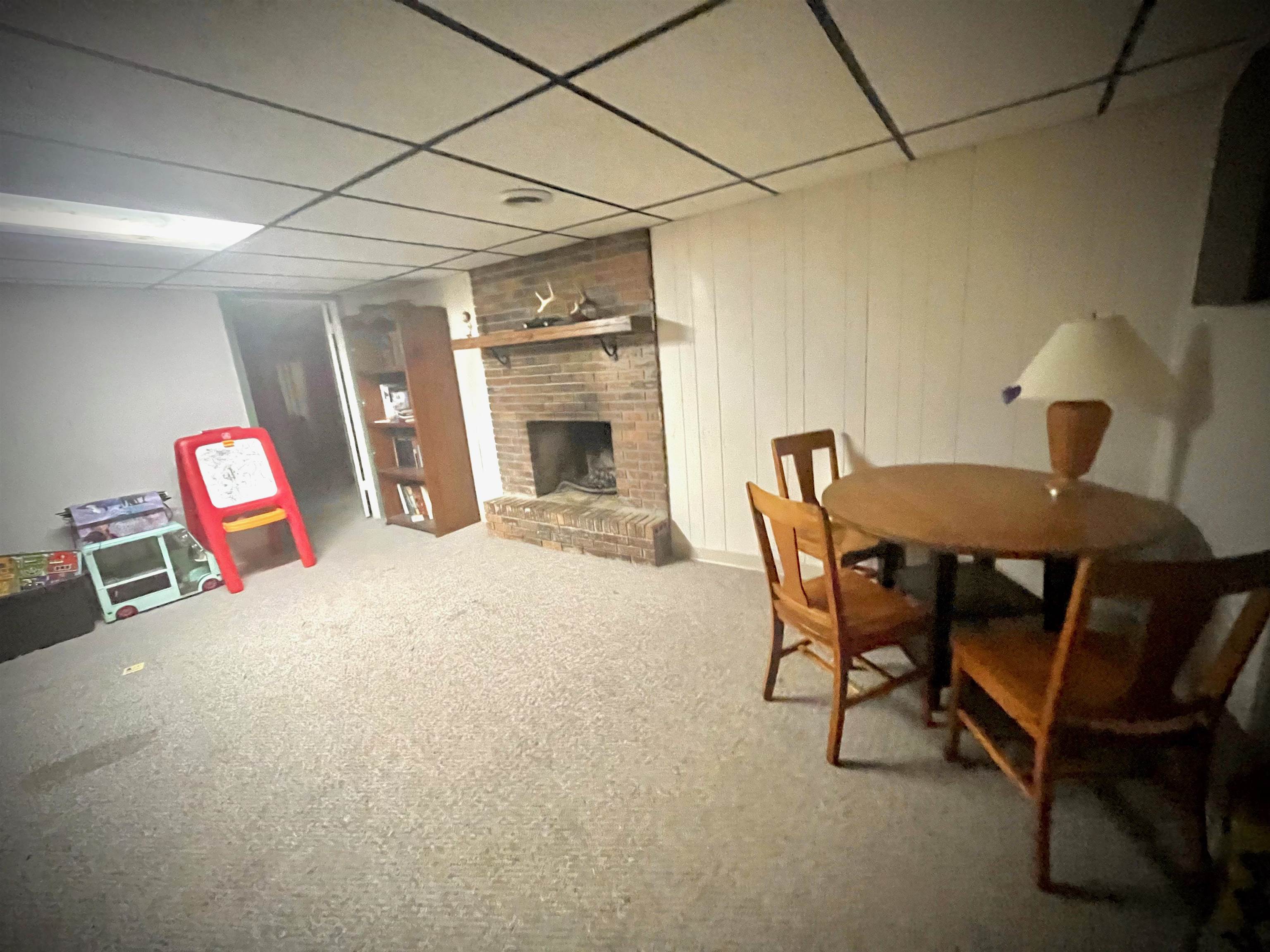 7356 Kishwaukee Road Rockford, IL 61109 - Photo 42 of 71 a view of a livingroom with furniture and a dining table